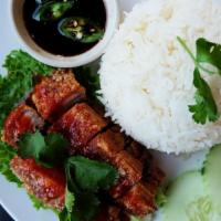 Crispy Pork Belly Rice (Kao Moo Grob) · Crispy pork belly, jasmine rice, five-spice sauce, pickled ginger, side of tangy soy sauce.