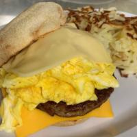 Loaded English Muffin With Hash Browns · With scrambled egg, American cheese, Swiss cheese, bacon or sausage patty.