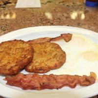 Potato Pancakes Combo   · With two eggs , two strips bacon or sausage links and two potato pancakes.