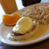 Eggs Benedict · Two eggs and Canadian bacon on an English muffin.  Topped with hollandaise sauce. Side of ha...