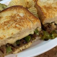 Philly Cheese Steak Panini · With grilled peppers, onions & Swiss cheese.