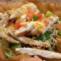 Taco Meat Or  Grilled Chicken Taco Salad · In a taco bowl filled with crisp greens, green peppers, shredded cheddar cheese, diced tomat...