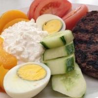 Low Cal Chop Steak · Served with cottage cheese, hard boiled egg, cucumbers, tomatoes and peaches