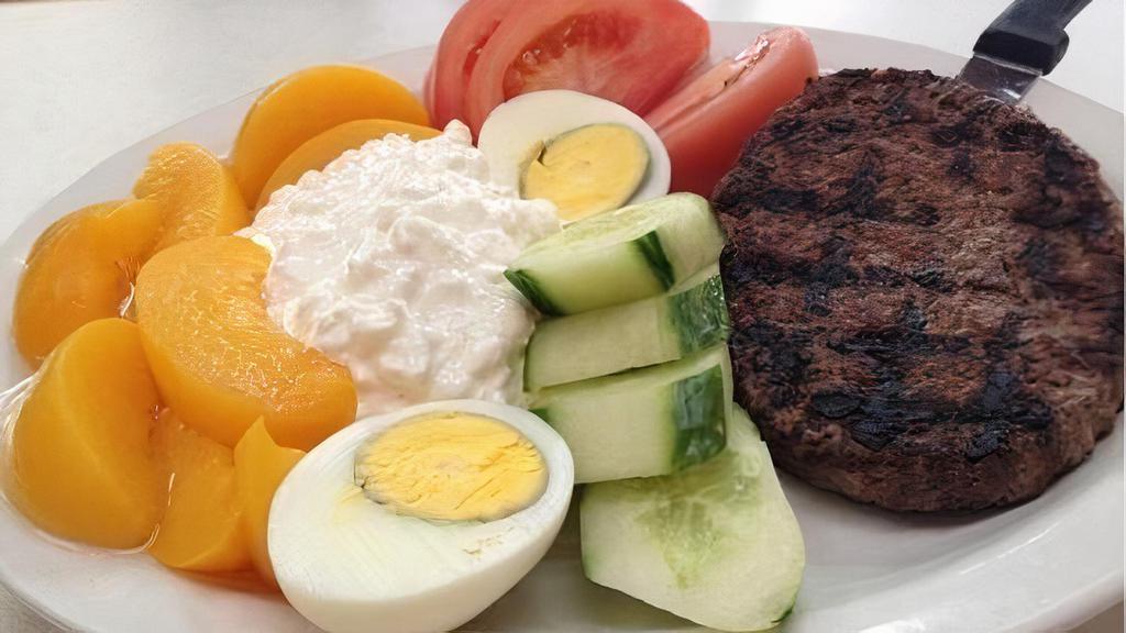 Low Cal Chop Steak · Served with cottage cheese, hard boiled egg, cucumbers, tomatoes and peaches