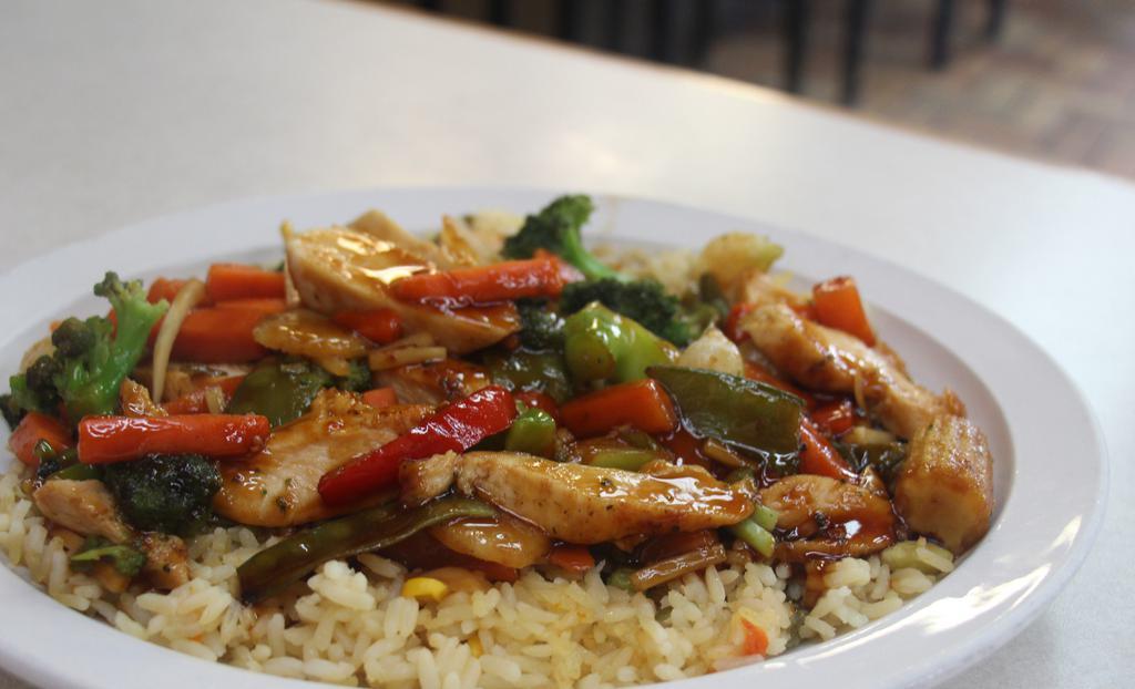 Chicken Stir Fry · With grilled vegetables , served over rice.