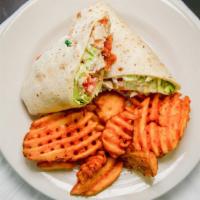 Ike'S Chicken Wrap · Choice of grilled or crispy chicken, lettuce, tomato, swiss cheese, and ranch dressing. Choi...