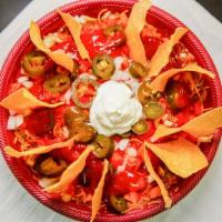 Taco Salad · Chili, beans, mixed greens, tomato, onion, cheese, salsa, jalapenos, and sour cream. Fresh f...