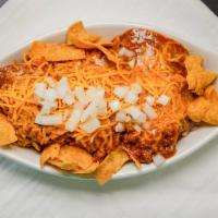 Frito Pie · Fritos, a lot of chili, onions, and cheddar cheese.