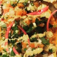 Grande Nacho · Taco chips, queso, braised beans, shredded beef, pico, cilantro and scallion, LIT sauce, chi...