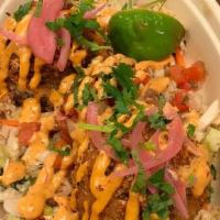 Crispy Rice App · Two balls of Crispy Fried Rice on slaw with pico tomato salsa, pickled red onion, chipotle a...