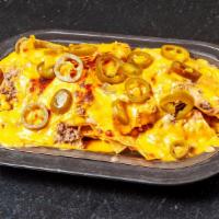 All Cheese Nachos · Make them supreme with lettuce, onions, tomatoes, sour cream & guacamole for an additional c...