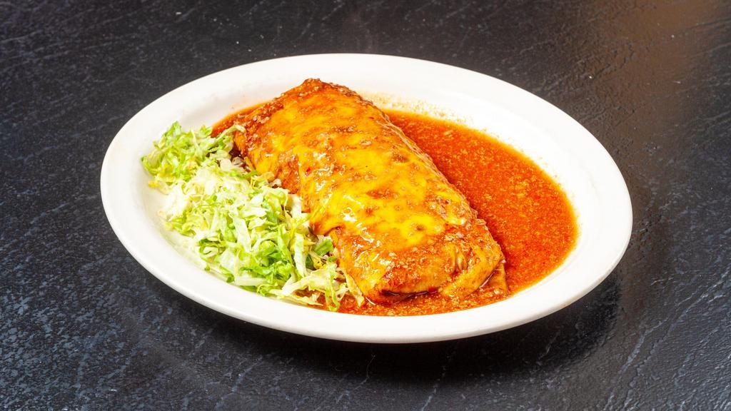 Pancho Villa · Jumbo flour Enchilada stuffed with beans, Ground Beef, Chile Verde, lettuce, tomato, and cheese. Topped with salsa Ranchera (hot) or Chile Verde (mild) and melted cheese.