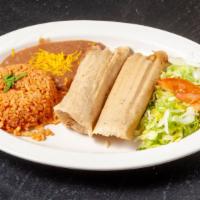 Fresh Handmade Tamales · Two tamales, made with fresh stone-ground corn masa, filled with Felipe's pork mole, wrapped...