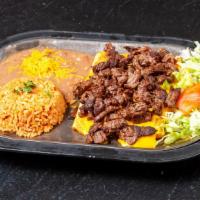 Steak Enchiladas · Two cheese enchiladas topped with carne asada steak chunks on top and served with beans and ...