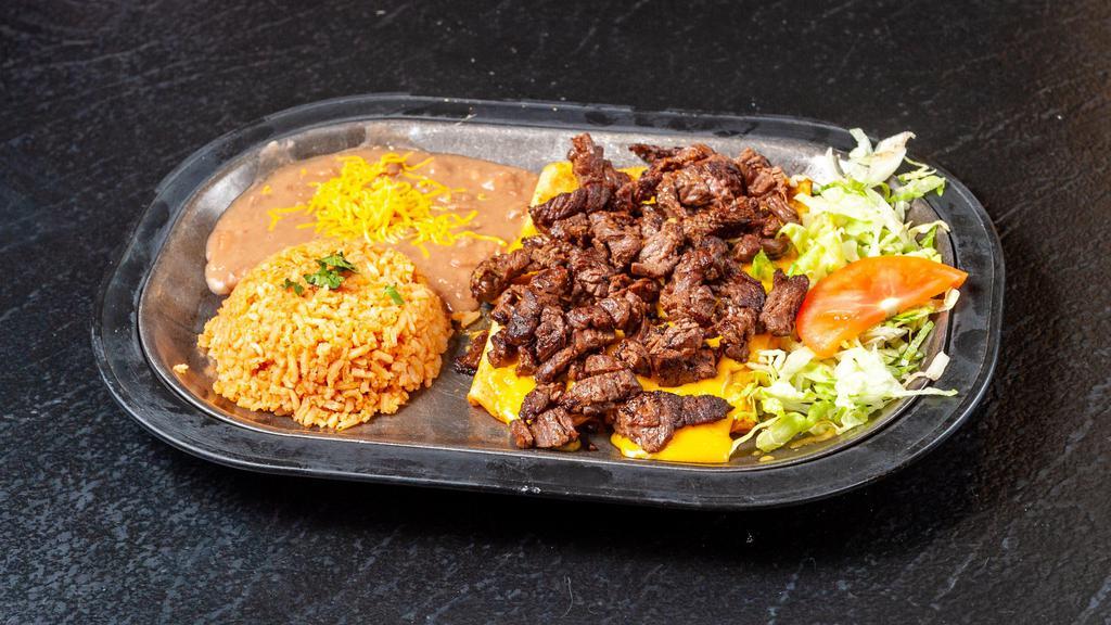 Steak Enchiladas · Two cheese enchiladas topped with carne asada steak chunks on top and served with beans and rice.