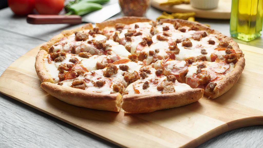All Meat Pizza · This pizza has our signature red sauce, fresh diced mozzarella cheese, sliced pepperoni, sliced Canadian bacon, juicy Italian sausage, and ground beef