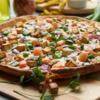 Paneer Tikka Masala Pizza Twist · This pizza has our signature tikka sauce, masala paneer, fresh diced mozzarella cheese, fres...