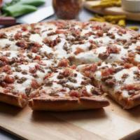 Cheeseburger Pizza · This pizza has our signature red sauce, fresh diced mozzarella, crunchy bacon, and ground beef