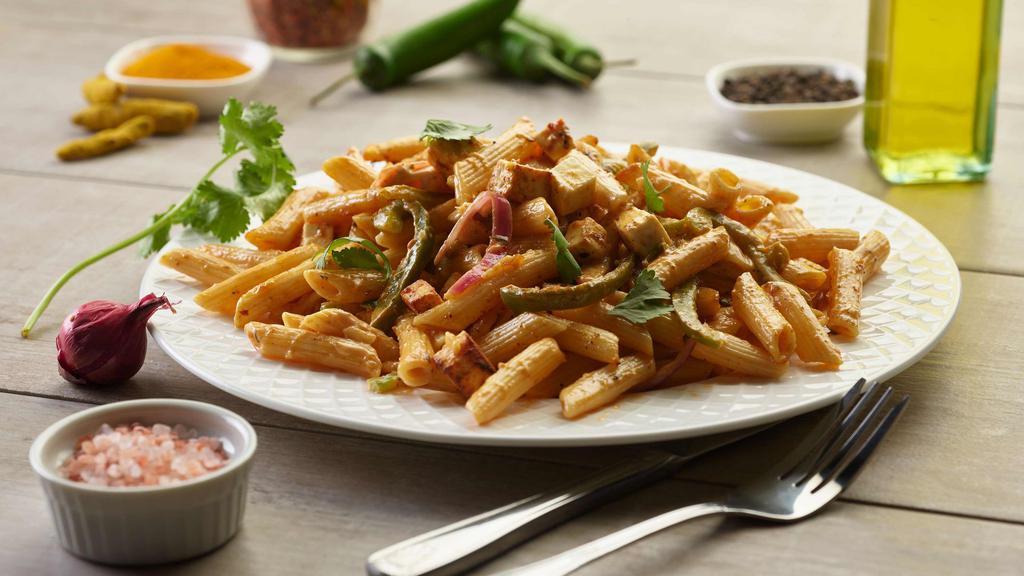 Shahi Paneer Pasta Twist · This pasta has our signature butter sauce, fresh sliced red onions, our masala paneer, fresh cut; garlic,  ginger, and green chilies, garnished with fresh cilantro.