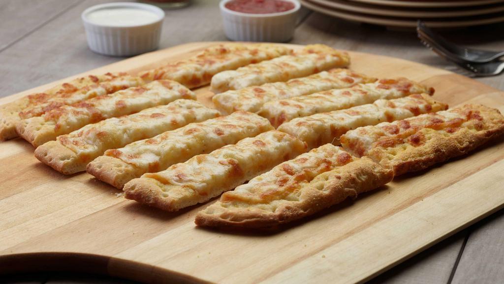 Vegan Cheesy Bread Twist · These breadsticks have our signature vegan creamy garlic sauce, and our signature vegan cheese