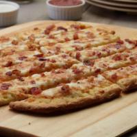 Cheesy Bacon Bread · These breadsticks have our signature garlic spread, fresh diced mozzarella cheese and crunch...