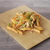 Masala Fries Twist · Our masala fries twist has sliced red onions, fresh cut; garlic, ginger, and green chilies, ...