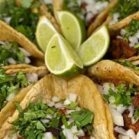 Taco Mexicano Dinner · ¡Nuestros tacos estilo callejero! Tres tacos de maíz blando con su elección de carne cubiert...