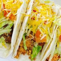 Taco Americano Dinner · Tres tortillas de harina blanda con la carne de su elección, cubiertas con lechuga, tomate y...
