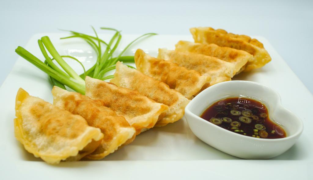 Pork Pot Stickers (8) · Ground Pork mixed with cabbages & Onions. Come with house ginger soy sauce.