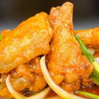 Oyster Wings (6) · Battered Fried Chicken wings stir fried with Yellow Onions, Scallions, & House Special Sauce.