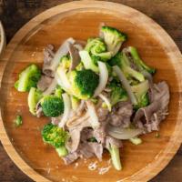 Beef With Broccoli · Beef Stir fired with Broccoli & Yellow  onions. Come with a side of white rice.