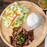Grilled Beef Rice Platter · Cucumber, lettuce, scallion, white rice, pickled carrot & daikon. Come with House fish sauce.