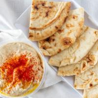 Hummus · Gluten free and vegan. A blend of pureed chickpeas, tahini, garlic, and extra virgin olive o...