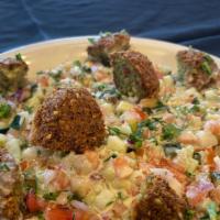 S3 Falafel Salad 10 Oz · Tomatoes, cucumbers, lettuce, red onions, parsley, pickles and mint. Topped with falafel wit...