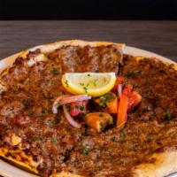 P4 Lahmacun Meat Pie · Open-faced pie, baked with ground lamb, beef, onions, and tomatoes.
