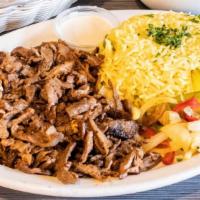 E1 Lamb  Beef Shawarma · Thinly sliced, slow-cooked and marinated beef.