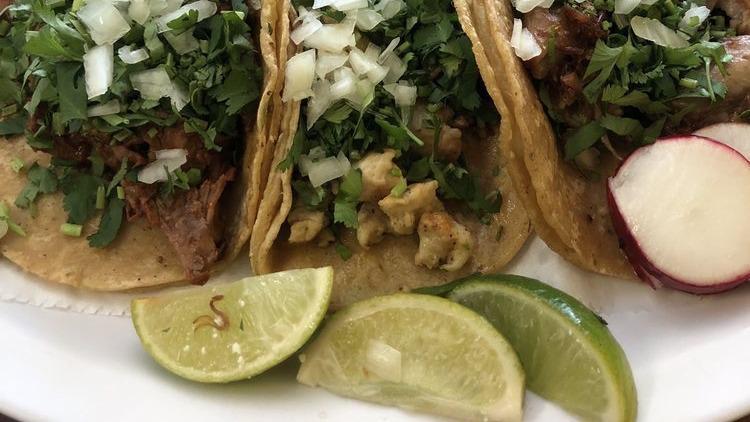 Taco Combo · Three tacos with your choice of meat, rice, beans, cilantro and onion. Includes a can of soda.