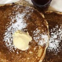 Homemade Buttermilk Pancakes (3) · Served with warm syrup and butter.