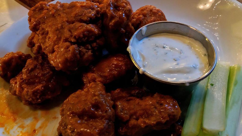 Wings · Slow baked then deep-fried, 10 bone-in wings tossed in your choice of sauce. Now available as housemade boneless wings - served with carrots, celery & ranch or blue cheese
