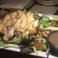 Southwest Chicken Salad · Grilled chicken on romaine lettuce with warm black beans & corn, tomato & crumbled tortilla ...