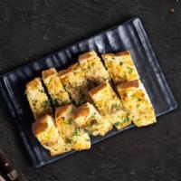 Garlic Cheese Bread · (Vegetarian) Housemade bread toasted and garnished with butter, garlic, mozzarella cheese, a...