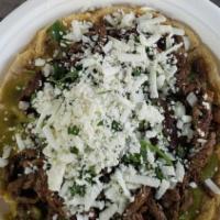 Sope Con Un Guiso · Tortilla are freshly made. Hand  made sope topped with salsa your choice of meat, chicken, o...