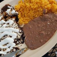 Enchiladas · Your choice of green salsa or mole topped with onion, cheese, sour cream, and steak or chick...