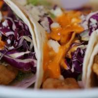 Shrimp Tacos · Battered Shrimp, lettuce & cabbage mix, mozzarella cheese and topped with spicy big bang sauce