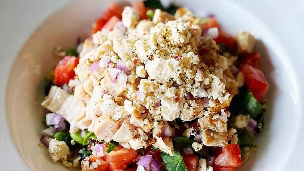 Mediterranean Power Bowl · Quinoa Blend with Edamme, Green Chickpeas, & Kale topped with Grilled Chicken, Chopped Spinach, Tomato, Red Onion, Feta & Green Vinaigrette