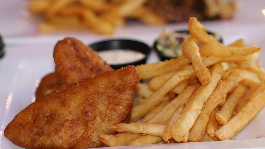 Tan Fins · Battered filets of cod served over a be of fried with slaw and tartar sauce