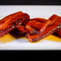 Nueske’S Double Smoked Bacon · Thick double-cut slab bacon, caramelized with burton’s maple syrup.
