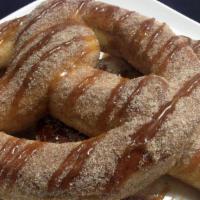 Sweet Pretzels · 2 soft baked pretzels topped with Cinnamon, Sugar & Drizzled with Caramel