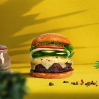Vegan Jalapeno Burger · Seasoned vegan burger patty topped with melted vegan cheese, jalapenos, lettuce, tomato, and...