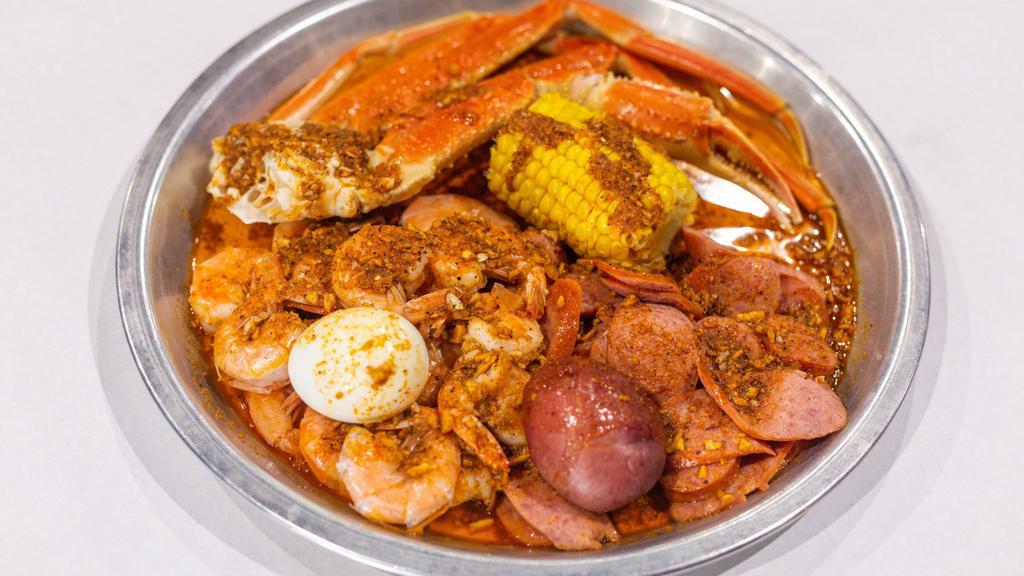 Famous Low Country Boil · 1/2 lb. snow crab legs, 1/2 lb. shrimp (no head), 1/2 lb. all-meat sausage, 1 boiled egg, 1 corn, 1 potato.